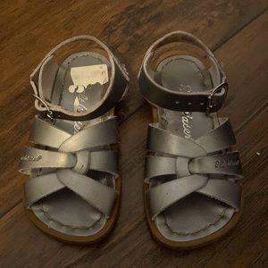 Size 7 silver Saltwater sandals with some wear